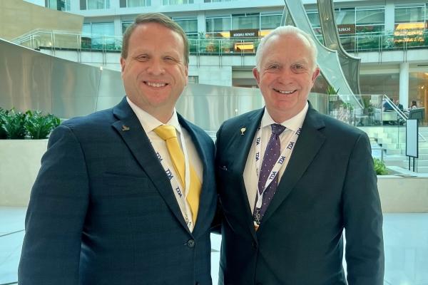 Dr. Keith Miller & Dr. Jeremy Thomas standing together and smiling at camera